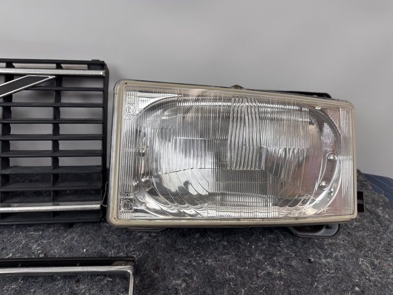 1975-1985 Volvo 240 TV Screen Headlight Set w/Flat-hood Eggcrate Grille 1246618