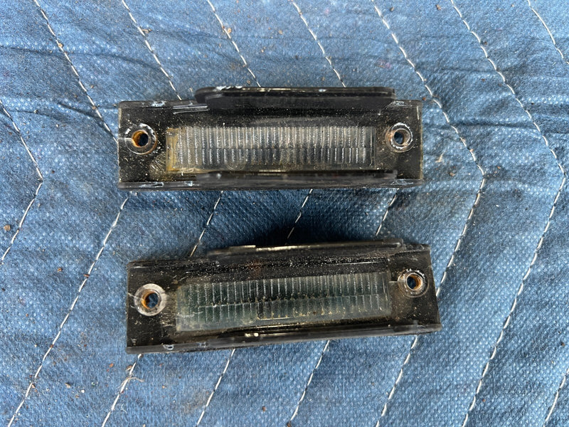 1983-1985 Porsche 944 License Plate Light Lamp Assembly Pair OEM #2556EM
