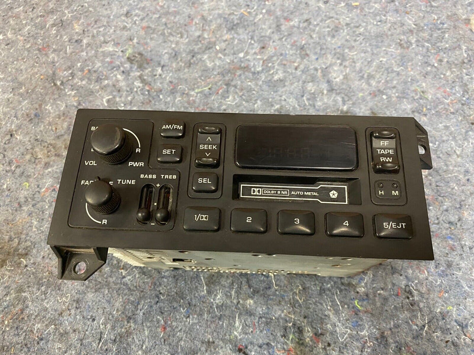 Dodge Chrysler Jeep AM/FM CASSETTE RADIO 4858556 84-02 Cherokee Wrangler #1229E